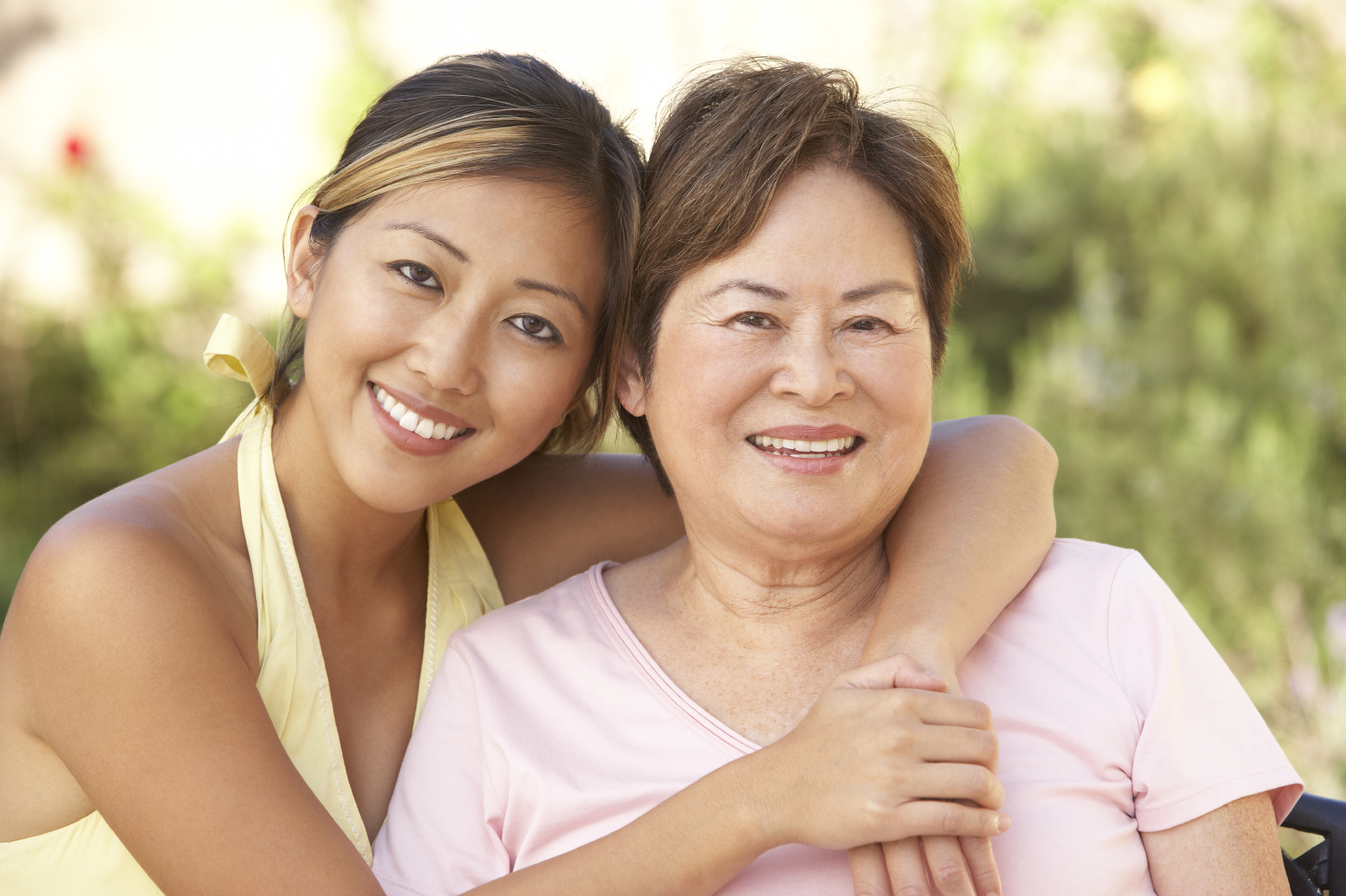 mom and daughter smiling for the campera